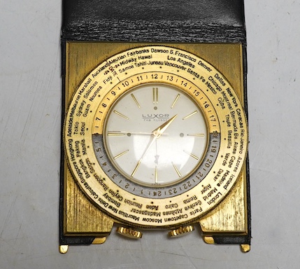 A vintage Luxor Swiss gold plated world time quartz travel alarm clock, in black leather case. Condition - fair to good